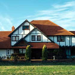 A big red roofed house in Auburn Meadow Community